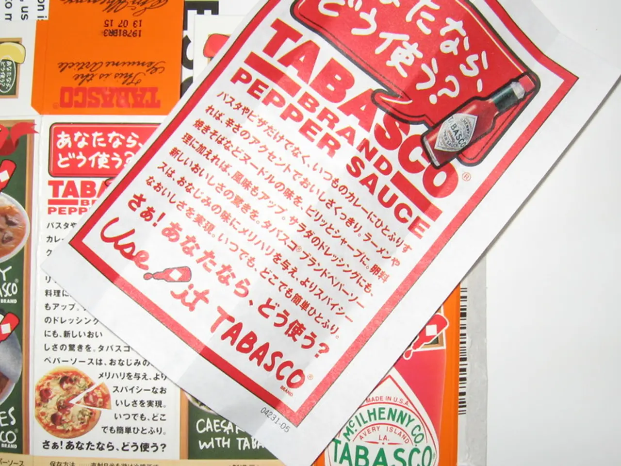 In the picture we can see a pamphlet with an advertisement of pepper sauce and under it we can see...
