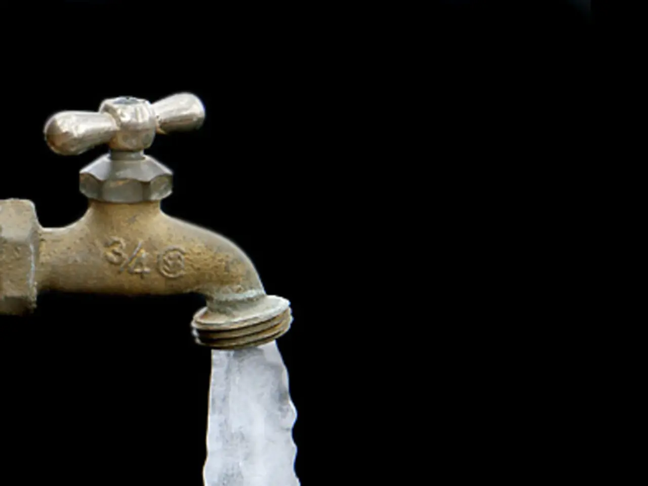 In this image we can see a tap with ice coming from the hole.