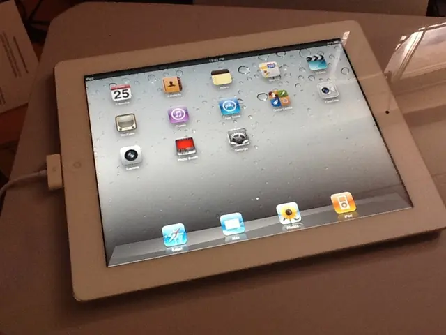 In this image, I can see a tablet with the display. These are the apps. This looks like a charging...