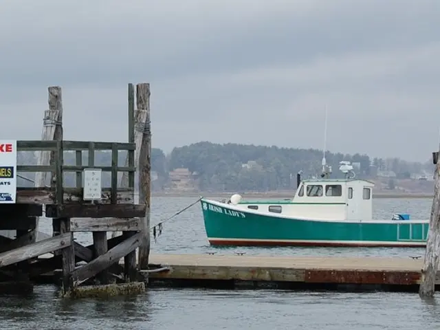 There are posters and containers are present on a dock as we can see at the bottom of this image....
